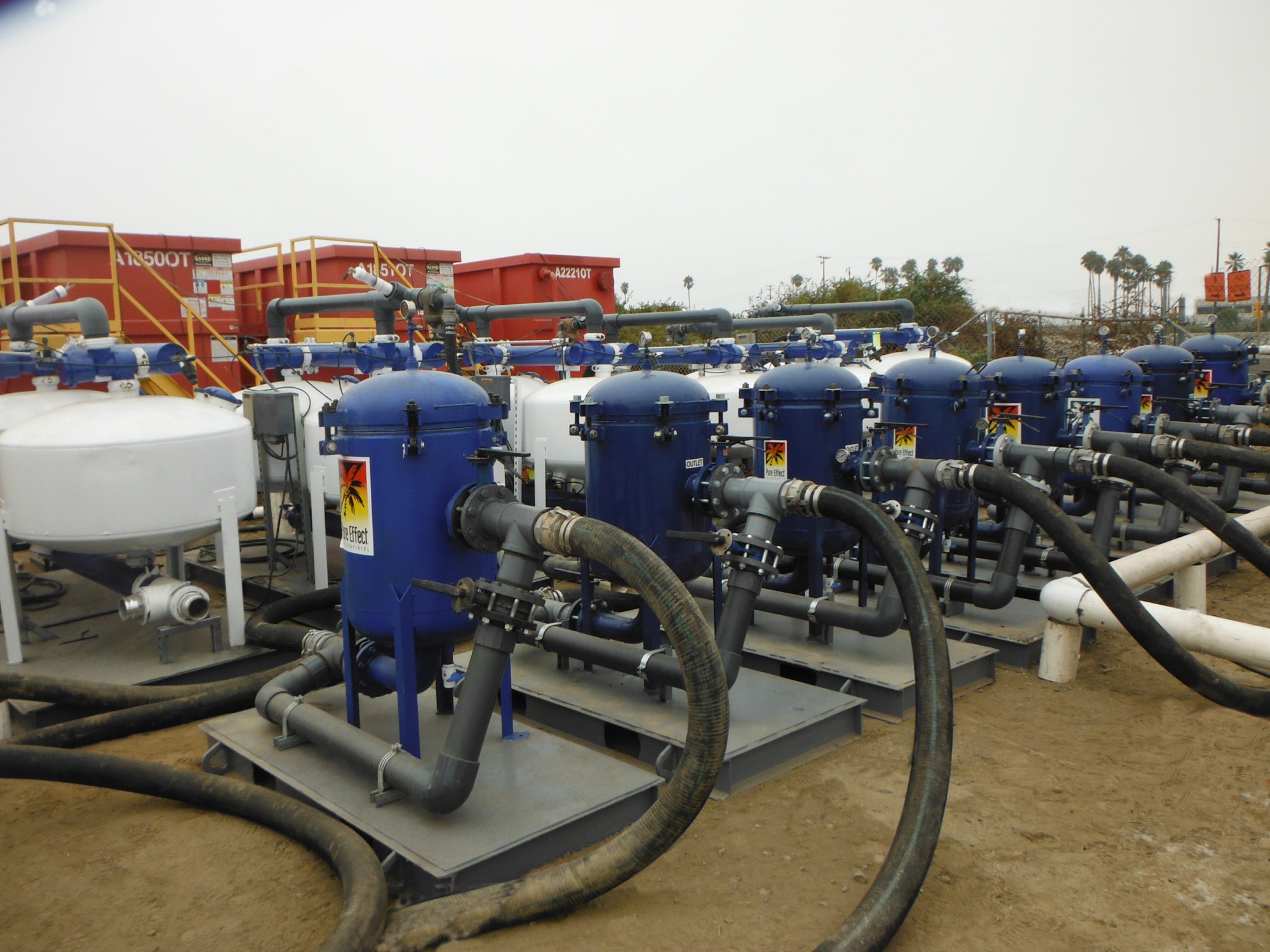 Pure Effect treatment tanks, carbon vessels and frac tanks staged across the company equipment yard