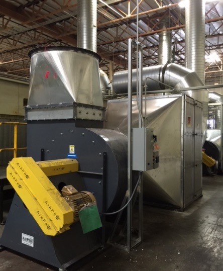 A large industrial AirPro blower and ducted carbon air-treatment system installed inside a facility